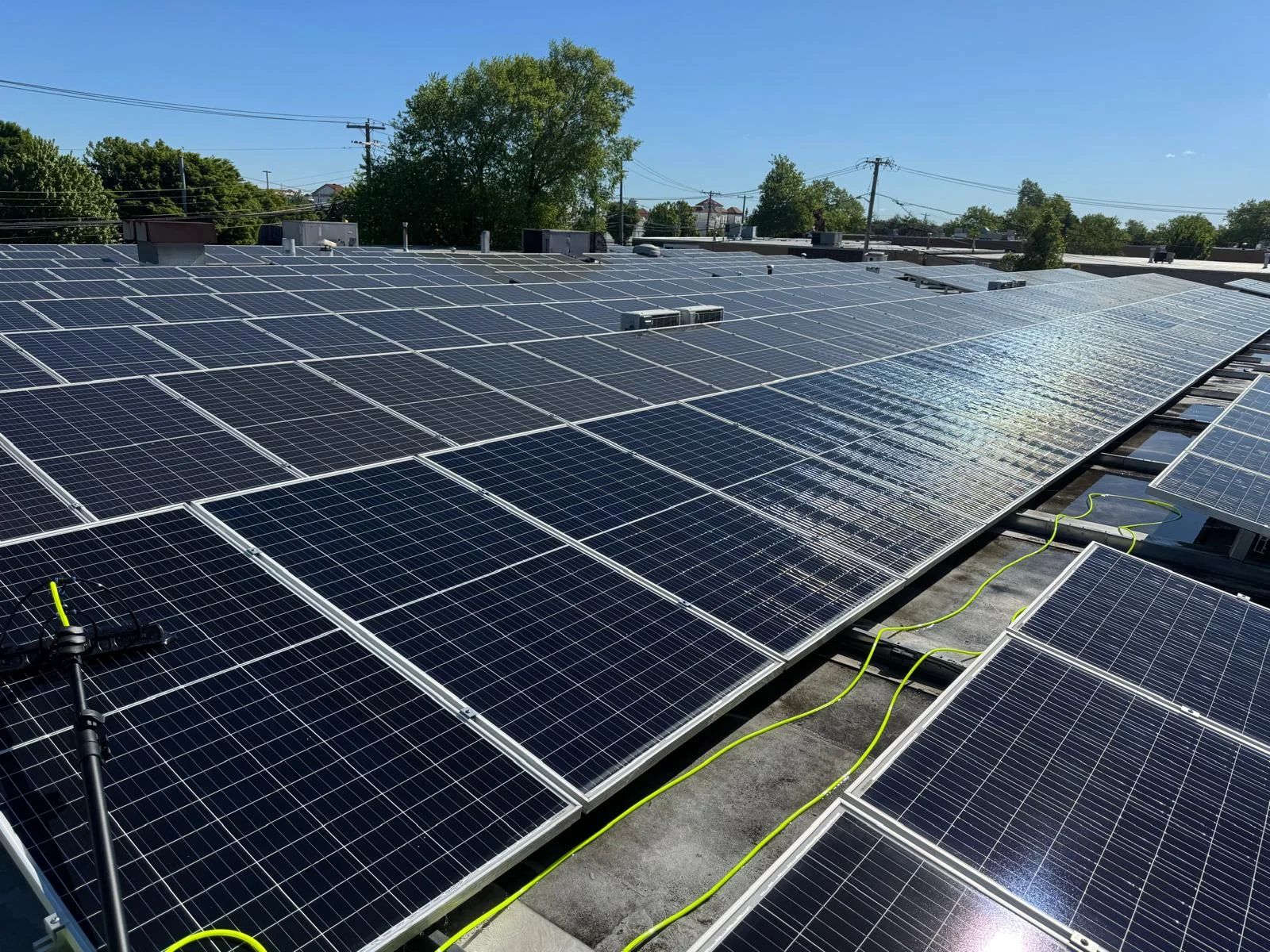 Sparkling clean solar panel field reflecting bright sunshine